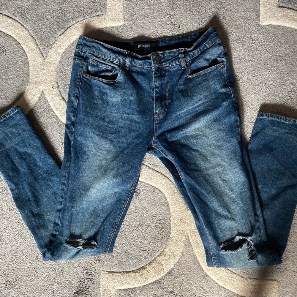 Blue distressed denim jeans